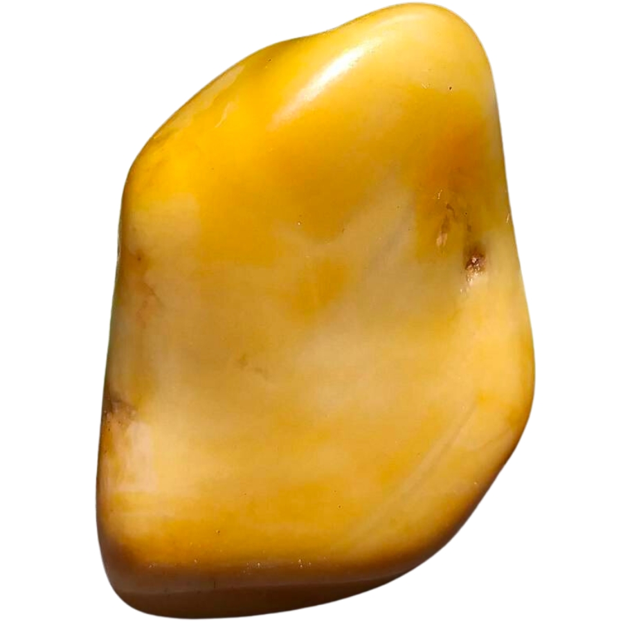 A shiny and visibly smooth piece of yellow jasper