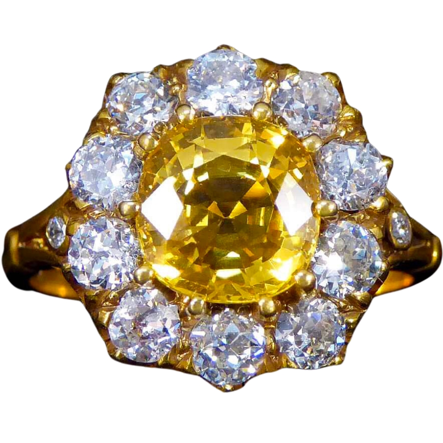 A golden ring with ten-claw setting of diamond and a big yellow sapphire as center stone