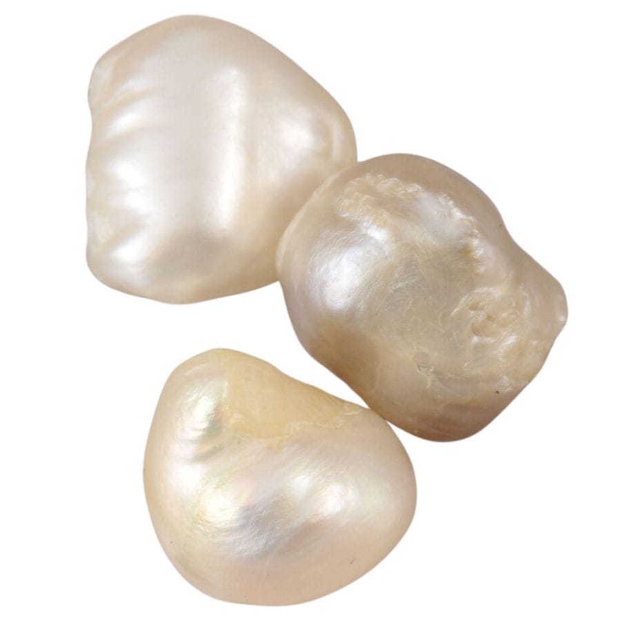three irregularly shaped off white freshwater pearl