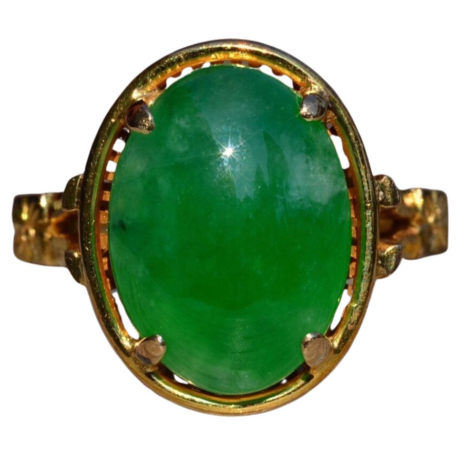 green imperial jade cabochon in a gold ring