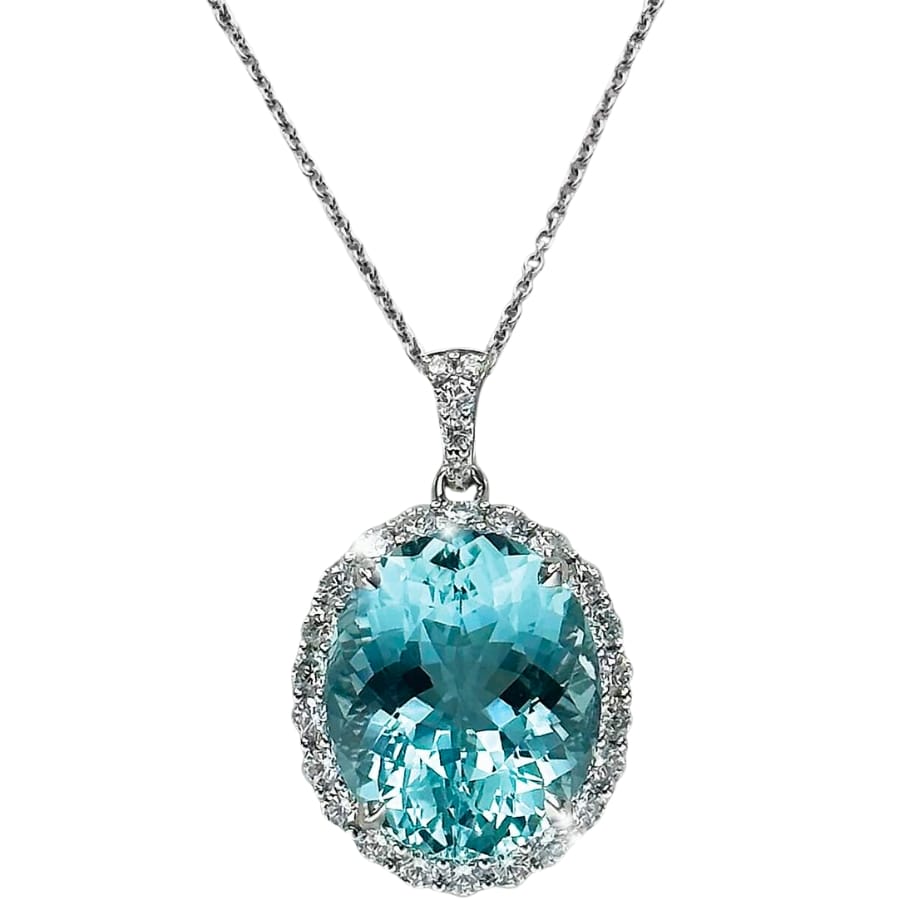 A sparkling blue-green aquamarine surrounded by small white diamonds on a white gold necklace