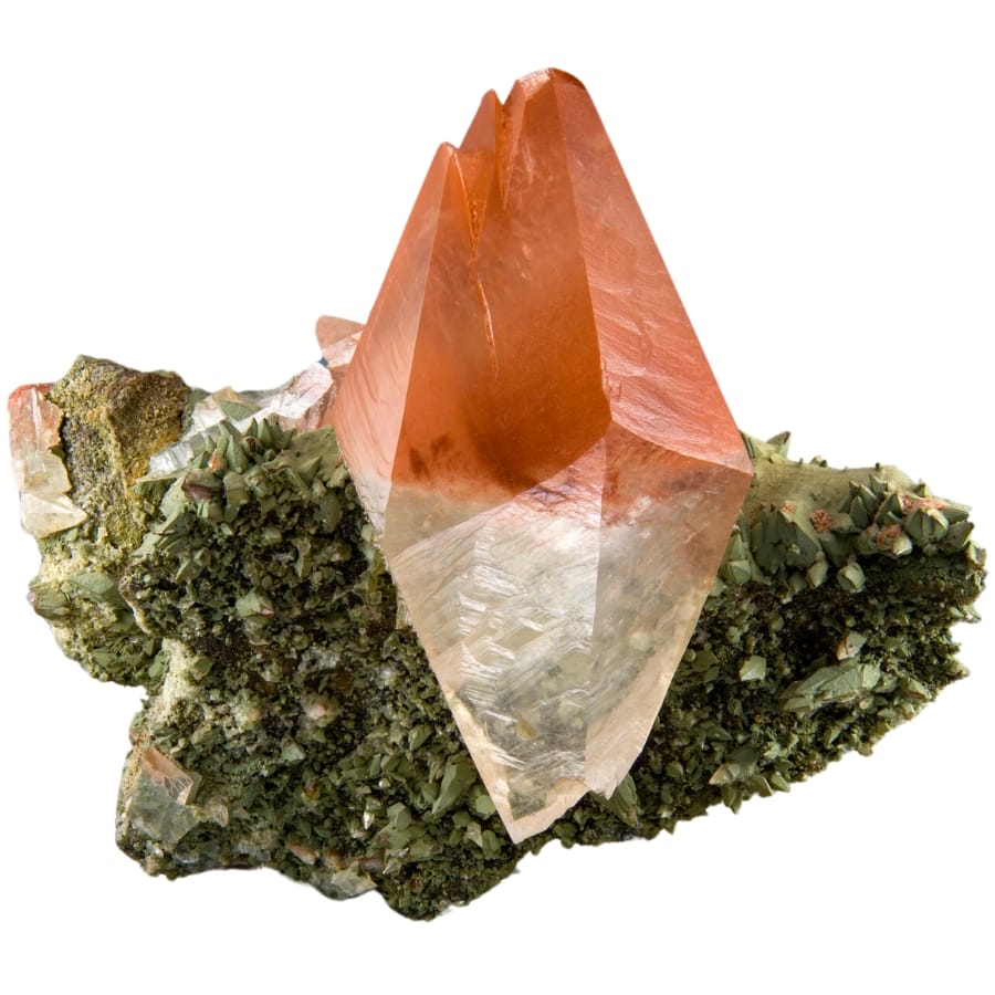 A beautiful bicolor calcite perched on a chlorite-covered matrix