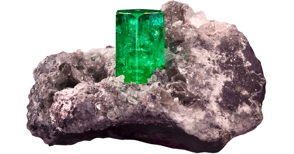 A vibrant green Colombian emerald on a rock matrix