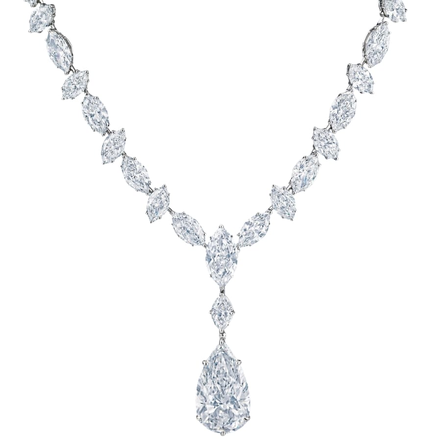 A diamond necklace with a large, sparkling, pear-shaped diamond pendant