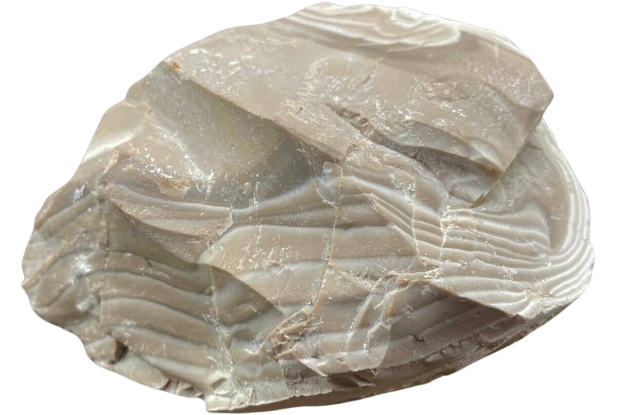 A raw flint stone with banded or striped appearance