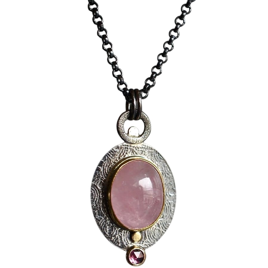 A gemmy morganite pendant with a small faceted pink tourmaline