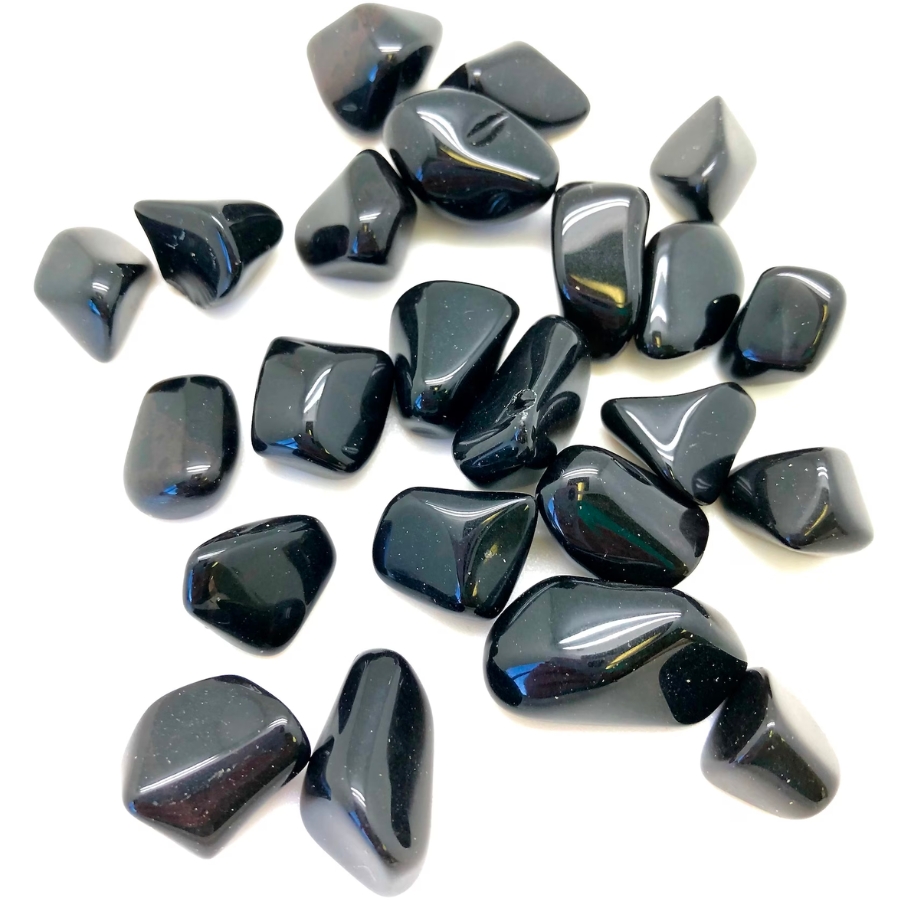 A bunch of tumbled black onyx stones