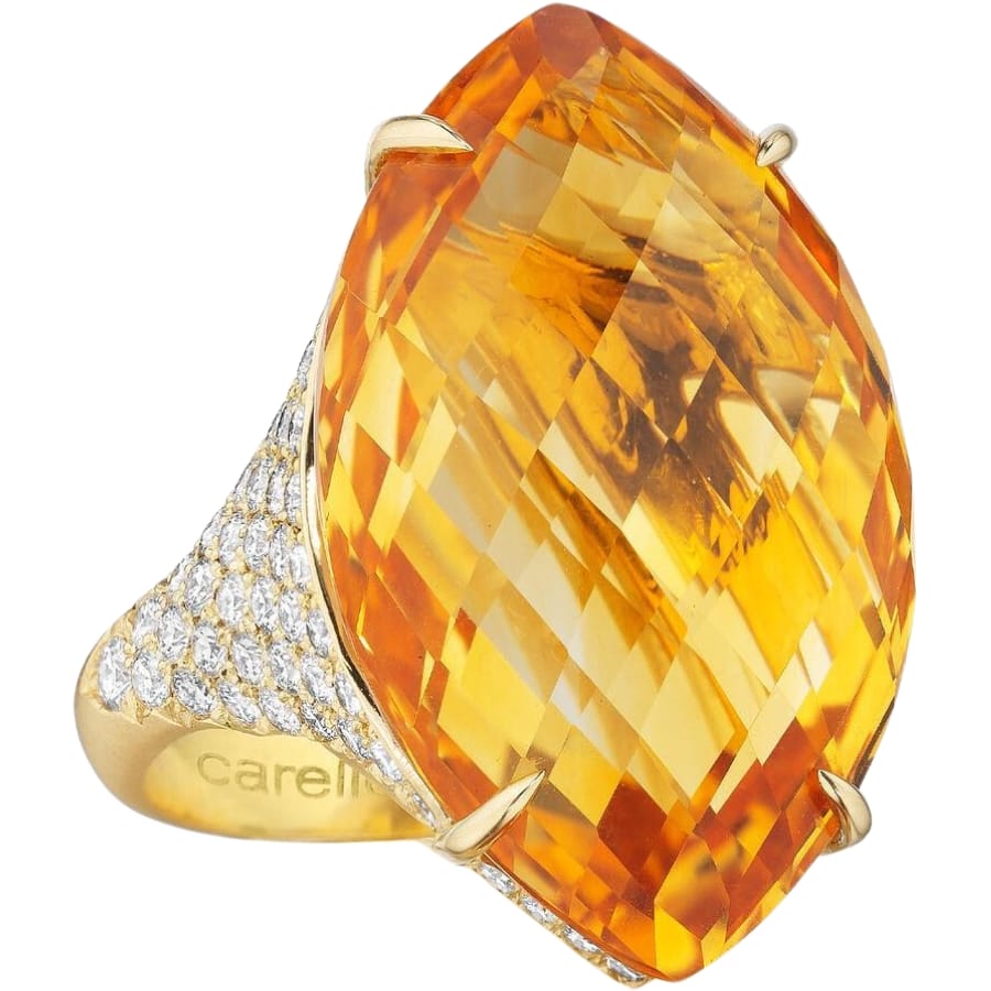 Close-up look at a brilliant orange citrine set as a center stone to a gold ring