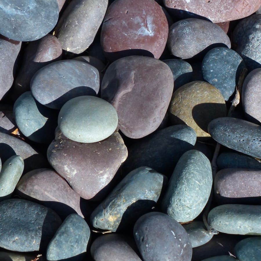 A bunch of colorful, smooth river rocks