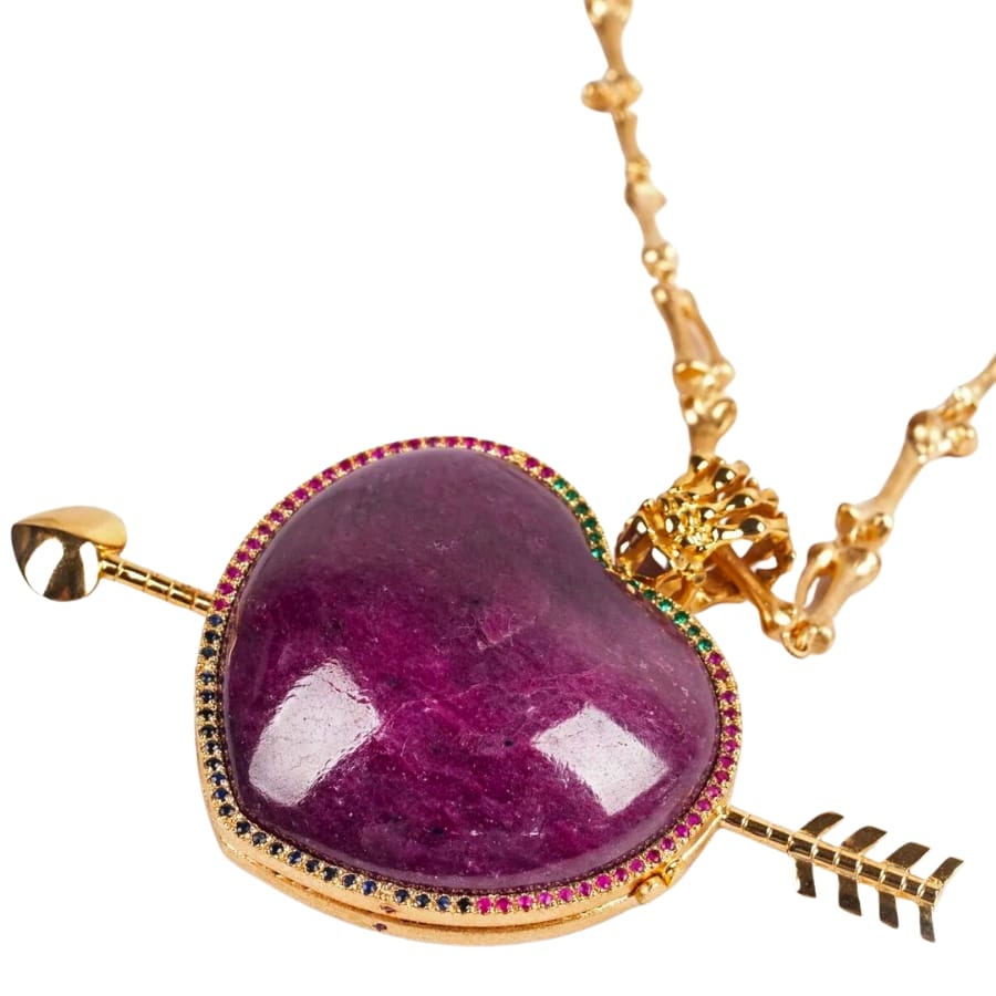A hand-carved locket made out of purplish-red Tanzanian ruby