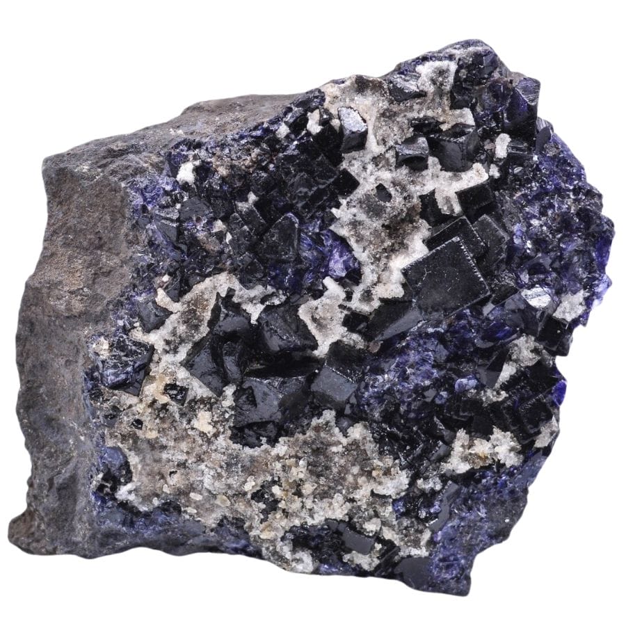 purple antozonite fluorite crystals on a rock