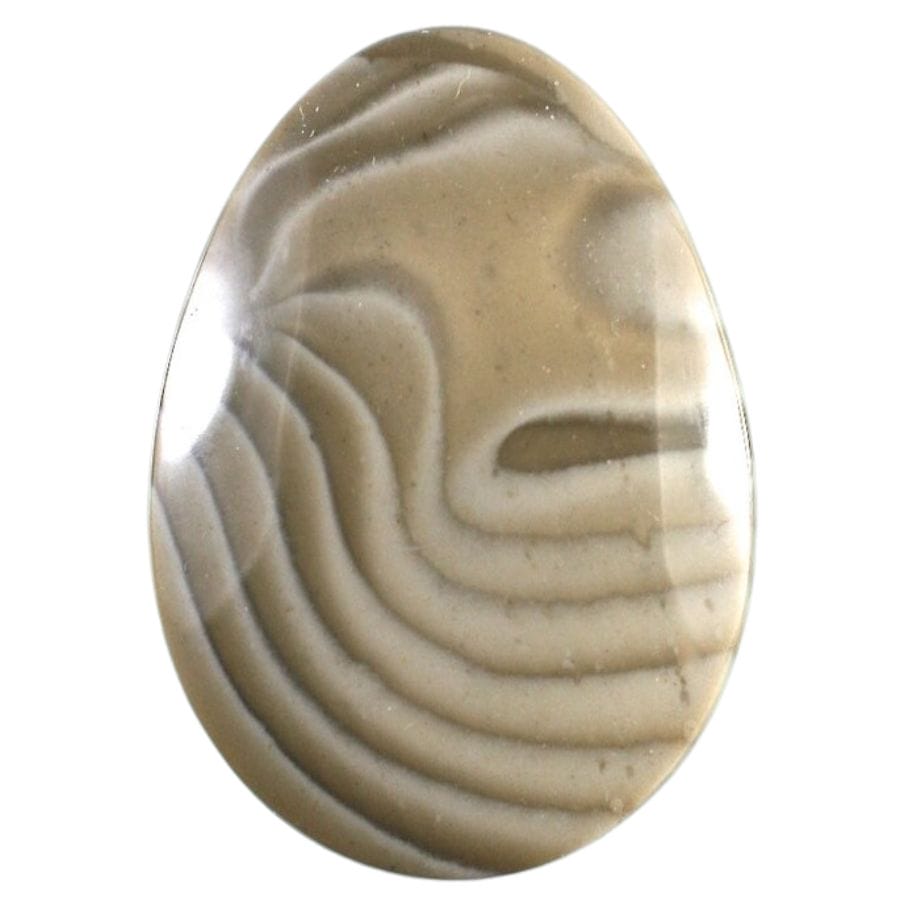 egg-shaped chert cabochon with brown bands