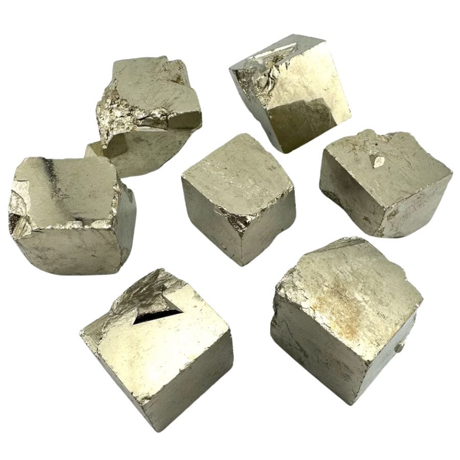 seven golden cubic pyrite crystals