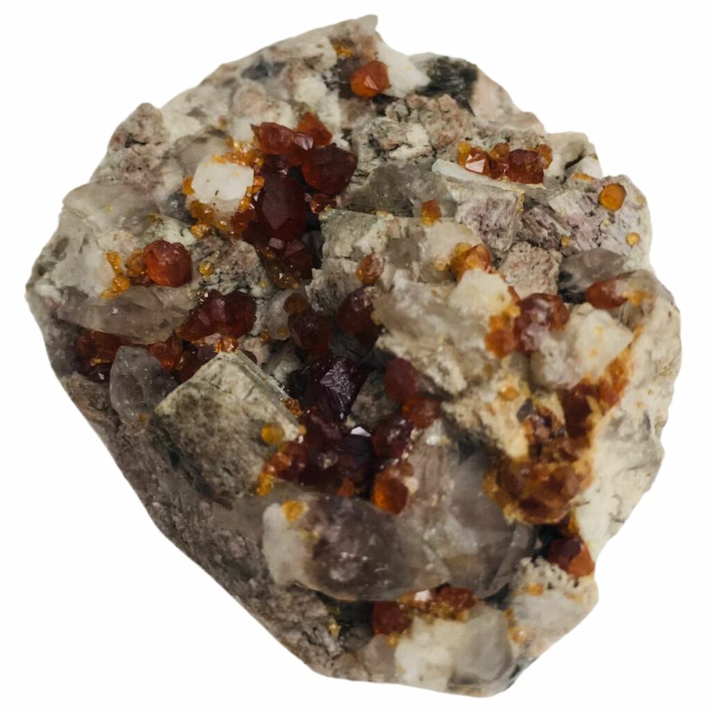 orange garnet crystals on a rock