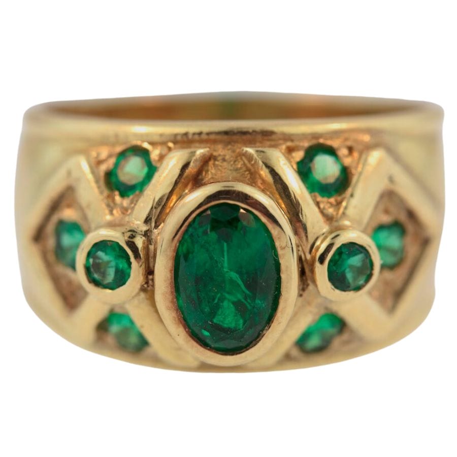 gold ring with nine green Sandawana emeralds