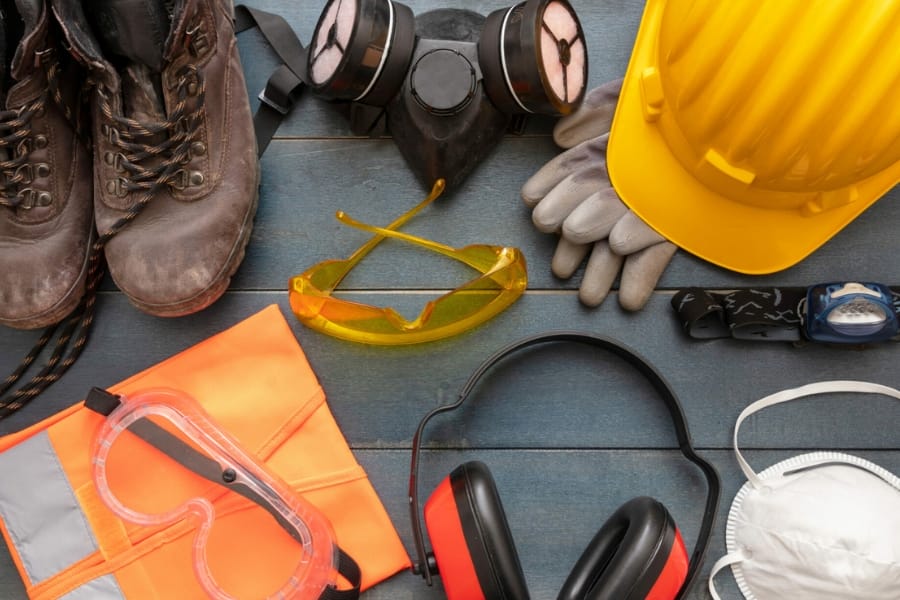 Several tools and equipment for crystal hunting such as boots, helmet, eye protector, mask, gloves, and ear muffs