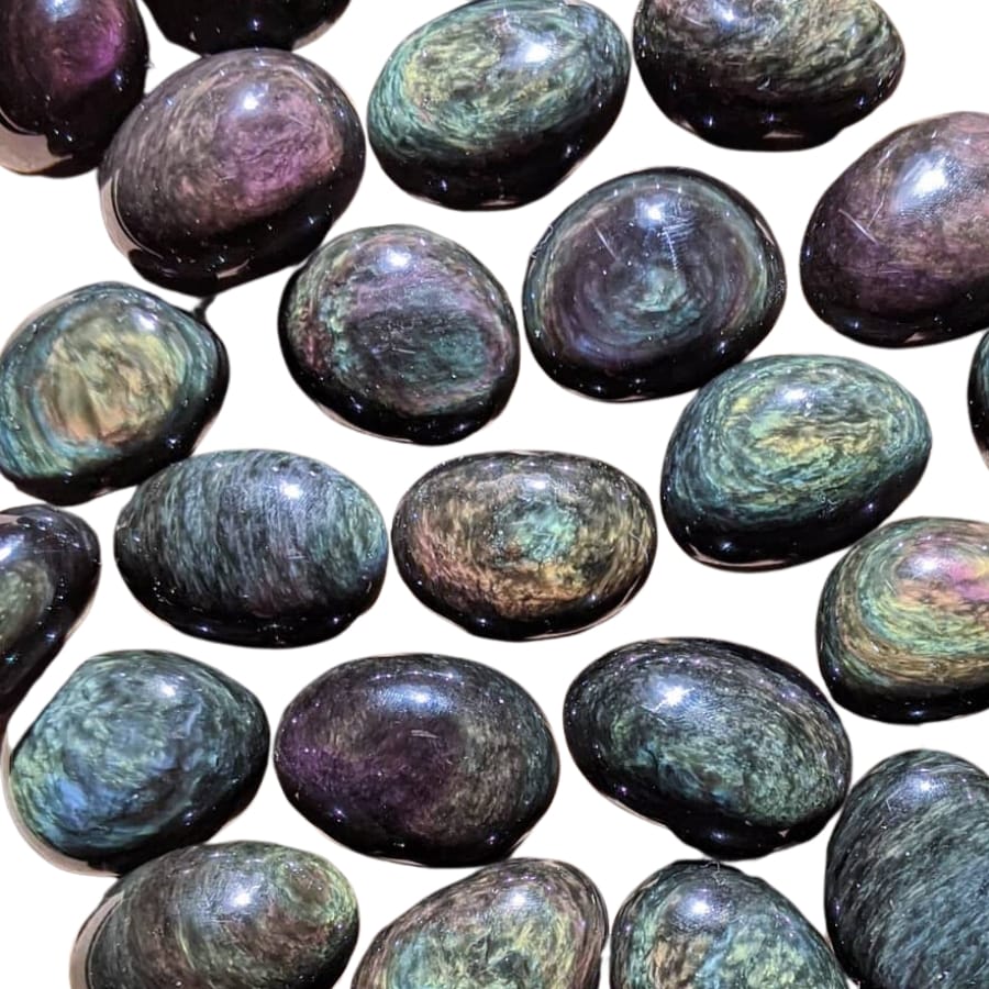 Several cabochons of uniquely colorful peacock obsidian