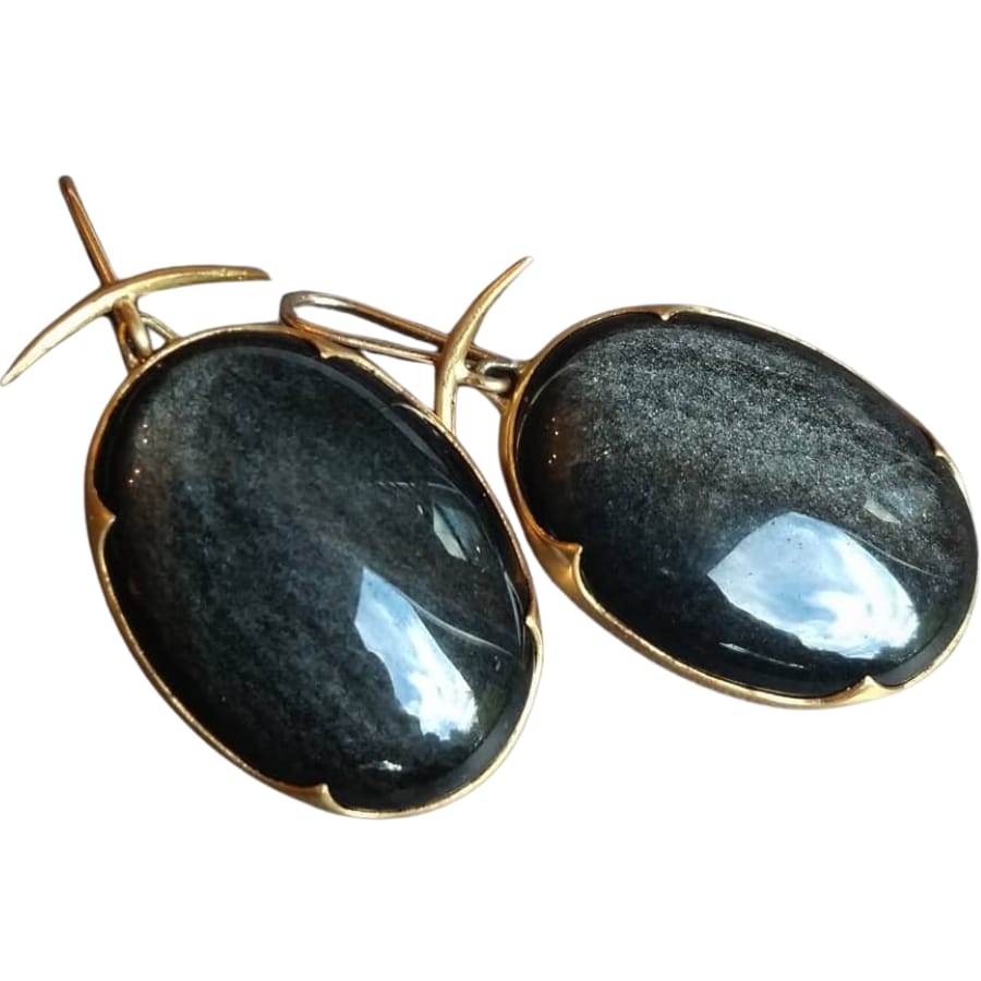 A pair of lovely gold earrings adorned with shiny silver sheen obsidians