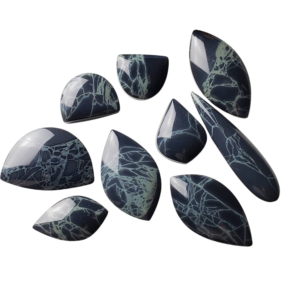 Spiderweb obsidian cabochons of different shapes and sizes