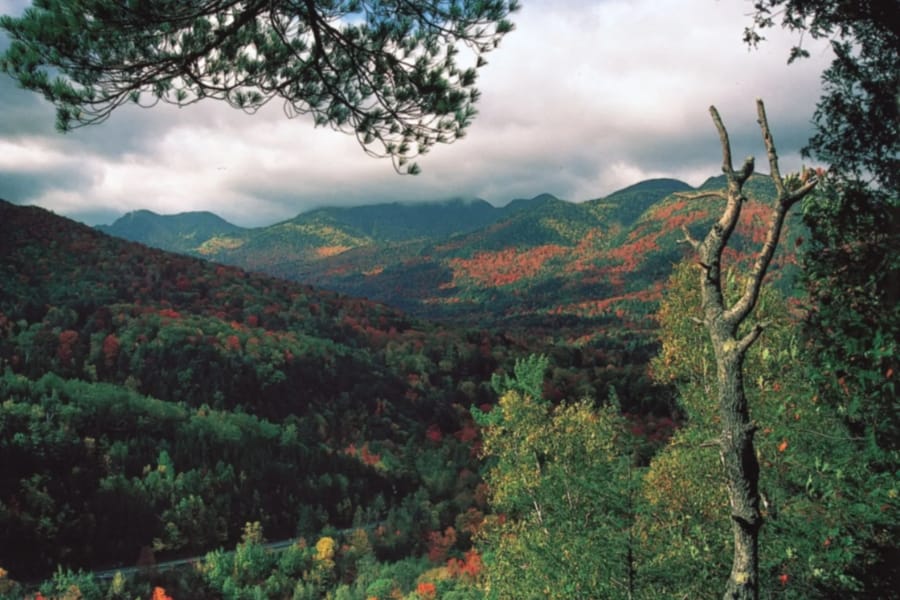 Serene and scenic view of Adirondack Mountains filled with lush greeneries