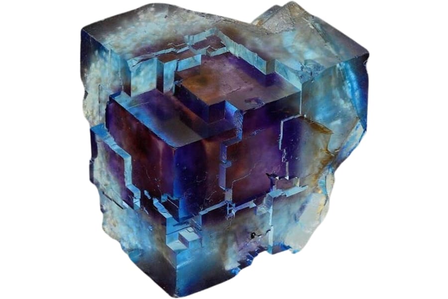 A mix of vibrant blue and deep purple colors in a single raw fluorite from Denton Mine