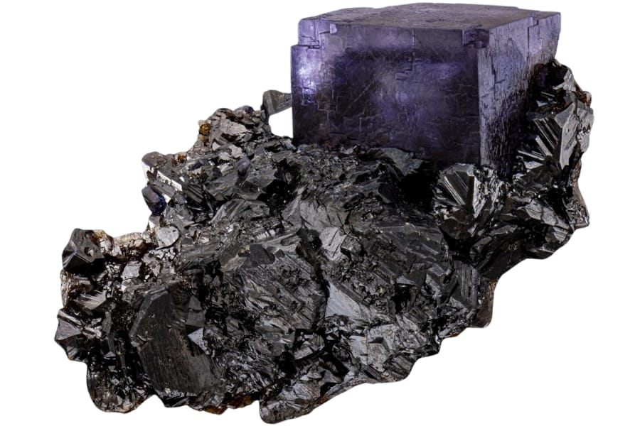 A purple fluorite crystal on a dark red-brown sphalerite from Elmwood Mine