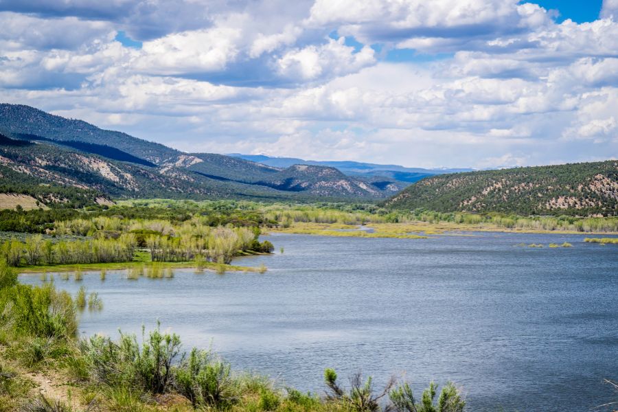 view of a large lake with mountains on the horizon