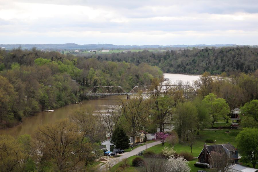 aerial view of a lake with a bridge over it