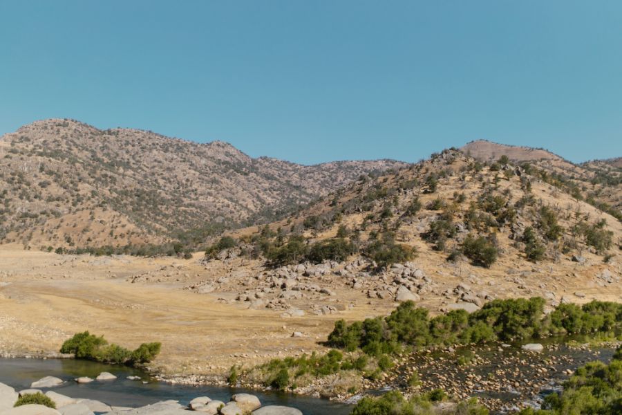 bushes on hills in an arid desert valley