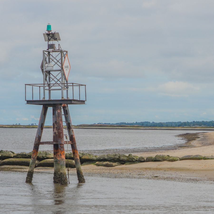 sandy beach at the mouth of a river