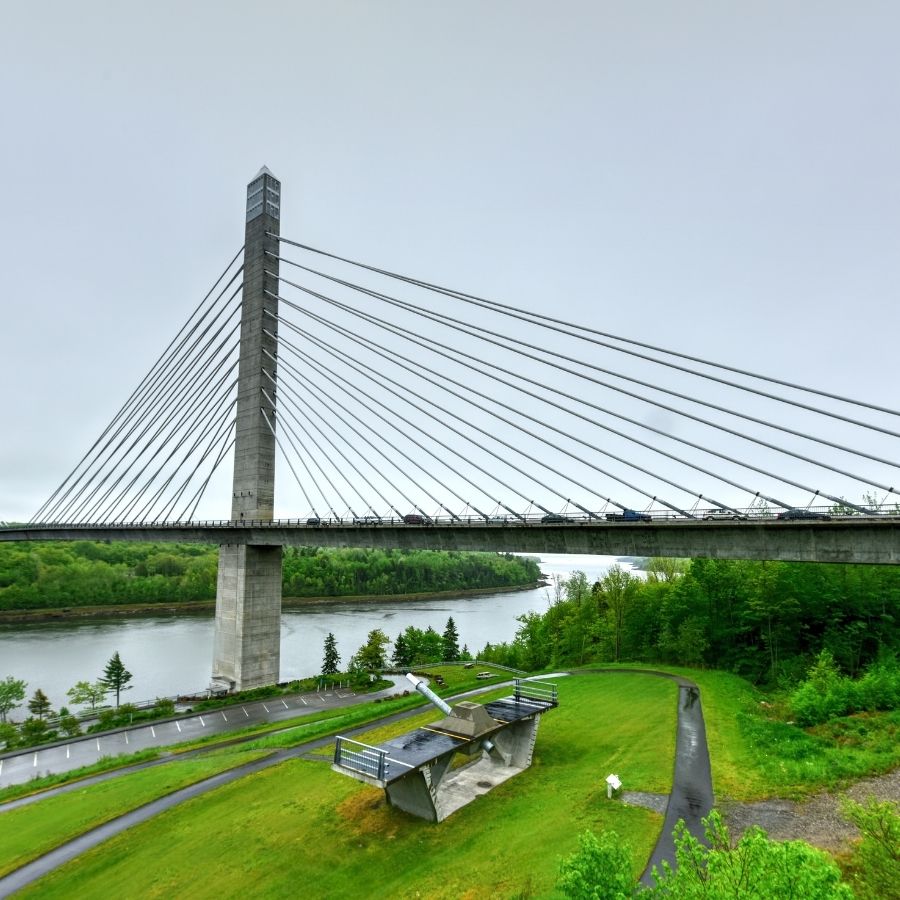 metal and concrete bridge over a river