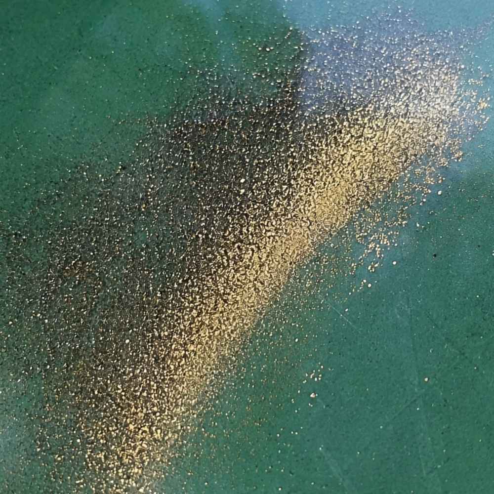 Fine flour gold and black sand in a gold pan from Iowa stream gravel